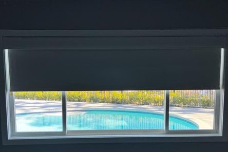 Bedroom window with fully lowered blackout shade, offering maximum privacy and light control, installed by Master Window Shade in San Jose.